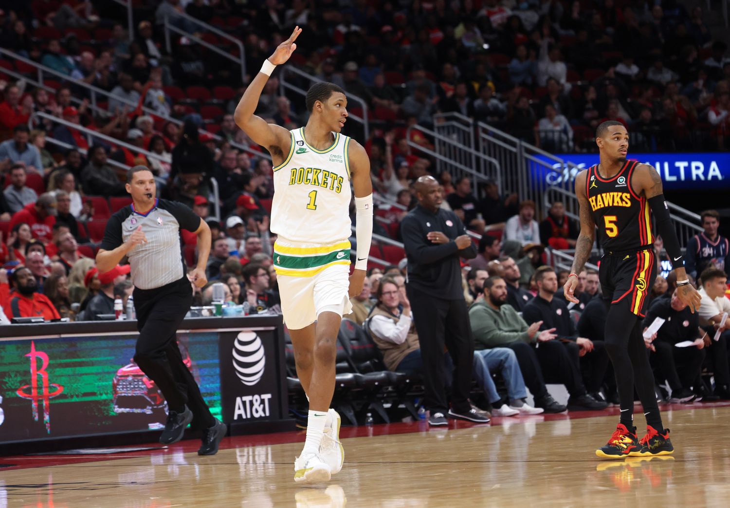 Rockets forward Jabari Smith Jr. (1) reacts to his three-point basket against Atlanta Hawks guard Dejounte Murray (5) in the third quarter at Toyota Center.